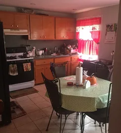 Kitchen before the remodel, with orange cabinets